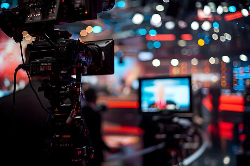 Close up of a television camera recording in a studio